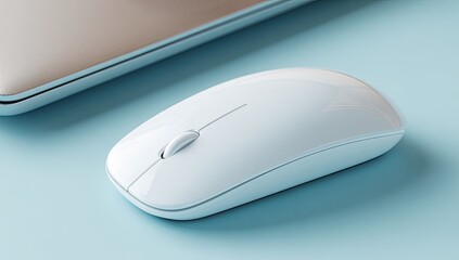 A white computer mouse sits beside a light beige laptop on a light blue surface