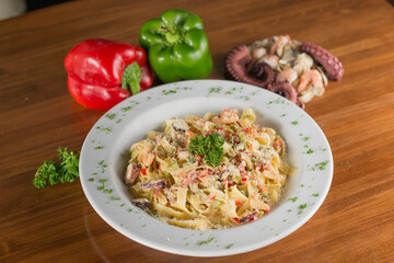 Creamy Seafood Fettuccine Alfredo with Shrimp, Calamari, and Parmesan