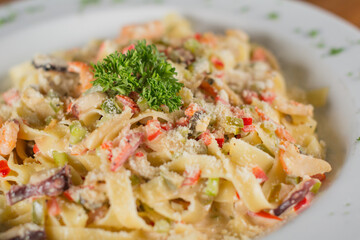 Creamy Seafood Fettuccine Alfredo with Shrimp, Calamari, and Parmesan