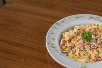 Creamy Seafood Fettuccine Alfredo with Shrimp, Calamari, and Parmesan