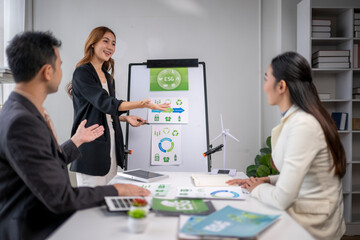 Businesswoman giving esg presentation during corporate meeting
