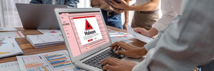 Cyber attacking concept. Malware alert showing on computer screen display scam and threat detection...