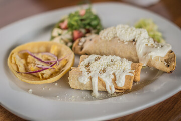Traditional Mexican Appetizer Platter (Botana) with a Chalupa and Chile Capon