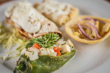 Traditional Mexican Appetizer Platter (Botana) with a Chalupa and Chile Capon
