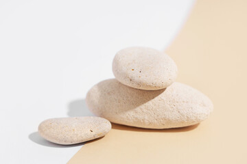 Stack of pebbles on color background. Zen concept