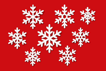 Christmas background paper cut snowflakes. White snow flakes set on red. Winter holiday vector. New Year's eve decoration. Festive design elements. Xmas season illustration.