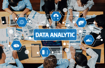 A diverse team engages in a collaborative data analytic session, utilizing digital charts and modern tools in a contemporary office environment. Amity