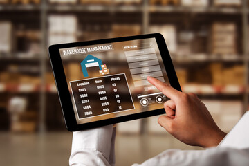 Warehouse management innovative software in computer for real time monitoring of goods package delivery . Computer screen showing smart inventory dashboard for storage and supply chain distribution .