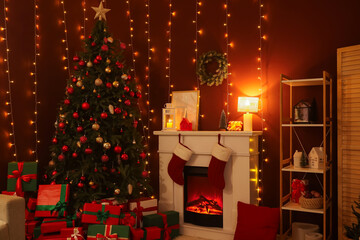 Interior of living room with fireplace, Christmas tree and glowing lights