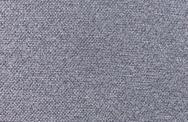 A gray-based fabric texture woven with multicolored threads.