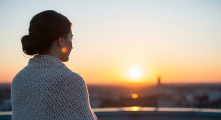 A woman from behind, watching the sunrise over a city skyline from a high viewpoint, a perfect concept for new beginnings, hope, and urban exploration