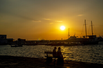 Sunset on the beach in Mykonos, Greece