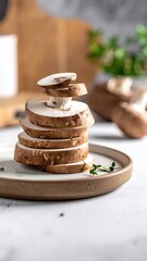 Tower of Sliced Portobello Mushrooms on Plate with Thyme Sprig on White Countertop