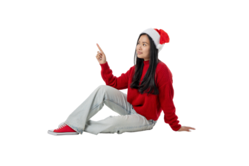 Girl in red sweater and Santa hat, joyfully pointing, isolated, PNG