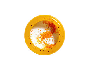Top-down view of a dessert in a yellow bowl