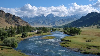 Scenic valley view with a winding river, distant snowy mountains, and scattered trees