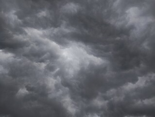Fototapeta premium Dark sky with heavy clouds converging, strong winds and a violent storm before the rain. Bad weather sky and climate change 