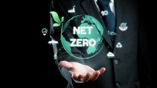 A businessman showcases a digital representation of the net zero concept, emphasizing the importance of sustainability and environmental responsibility for a better future. Qubit