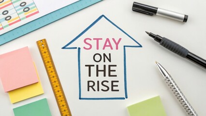Stay on the Rise: Motivational Concept with Office Supplies and Colorful Post-it Notes for Productivity and Success