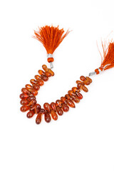 Hessonite Garnet Faceted Briolette Beads on White