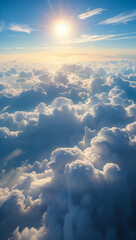 Obraz premium Bright sun shining above a sea of fluffy clouds