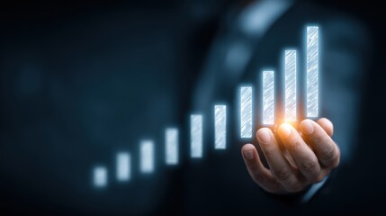 Businessman hand holding a glowing bar graph symbolizing financial growth and success.