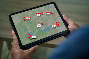 Local search marketing concept on tablet map with location pin and store icons showing mobile navigation and gps listing for nearby retail discovery boosting small business visibility and traffic