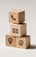 Obraz premium Stacked wooden blocks with communication icons