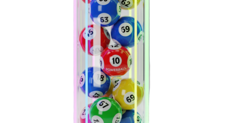 Close-up of colorful lottery balls in a transparent container against a greenscreen background.