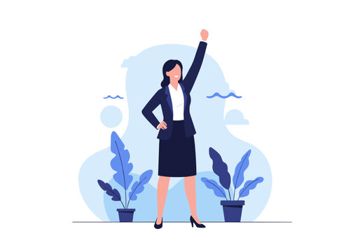 Successful businesswoman celebrating victory with raised fist.