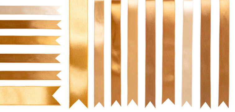 Big collection of golden satin ribbons, smooth straight tapes. Cut out image of glossy silk ribbons for holiday gift box, decor.	