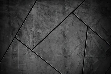 Close-up of textured dark gray stone tiles with angular grout lines creating a modern geometric pattern