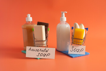 Toilet and household soaps, solid and liquid, and the corresponding inscriptions in close-up on a bright background