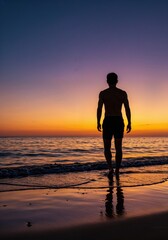 Seaside Solitude: A solitary figure stands silhouetted at the edge of the sea, facing a breathtaking sunset, with the colors painting the sky in fiery hues. 