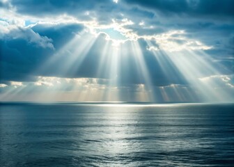 Sunbeams pierce through dramatic clouds over a calm ocean surface