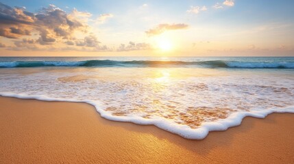 Obraz premium Golden sunset over a tranquil beach. Ocean waves gently kiss the shore
