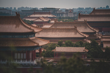 An elevated view of The Palace Museum, Beijing, showcases intricate, symmetrical architecture with...