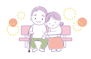 ベンチに座って幸せな表情で寄り添うシニアの夫婦