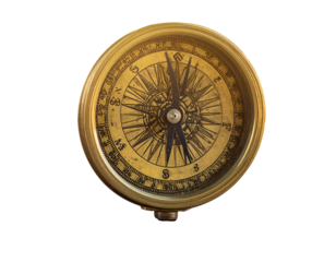 Vintage brass compass on wooden surface