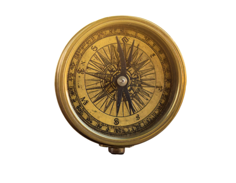 Vintage brass compass on wooden surface