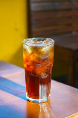 Iced Tea, captured on October 2, 2025. Refreshing chilled black tea served in a clear glass with ice cubes and lemon slice, golden amber color, perfect summer beverage lifestyle photography