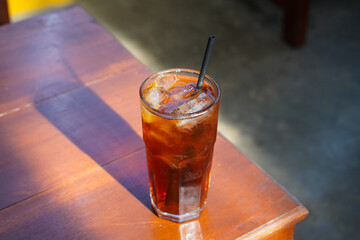 Iced Tea, captured on October 2, 2025. Refreshing chilled black tea served in a clear glass with ice cubes and lemon slice, golden amber color, perfect summer beverage lifestyle photography