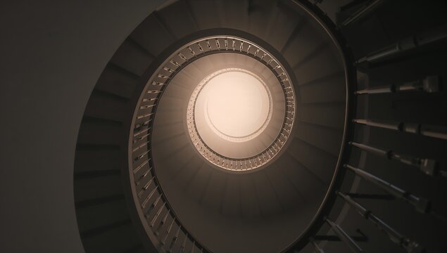 Spiraling Ascent: A mesmerizing view of a spiral staircase, ascending into an unknown place, evokes a sense of journey and exploration, beckoning the viewer to imagine the stories behind each step. - Powered by Adobe