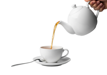 White porcelain teapot pouring hot amber tea into teacup on saucer with silver spoon, isolated on transparent studio background, soft light, concept of elegance and warmth