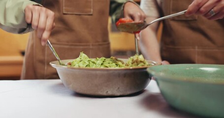 Pasta, cooking and hands of chefs in kitchen at restaurant with meal prep together for order. Industry, people and culinary employees with food for italian cuisine with catering on counter in diner.
