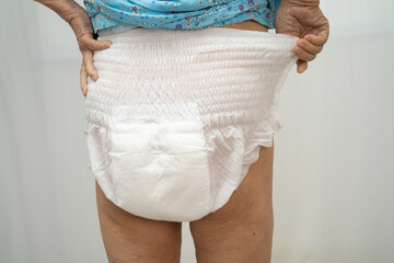 Asian senior woman patient wearing incontinence diaper.