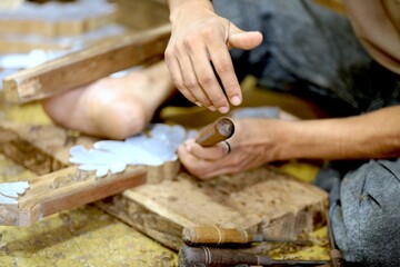 man sawing wood