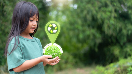 Little girl holding green moss ball with recycling icon and CO2 reduction graphic, sustainability, eco-friendly lifestyle, and environmental protection concept.