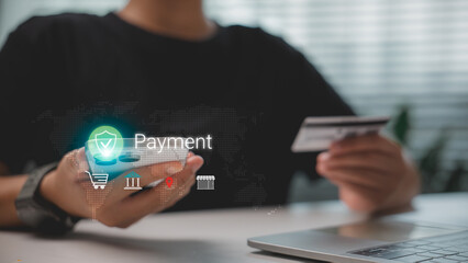 Person using smartphone and credit card for secure online payment, with holographic icons...