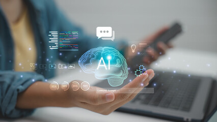 Artificial intelligence brain hologram with digital icons above hand, symbolizing machine learning, innovation, and smart technology in modern digital transformation.